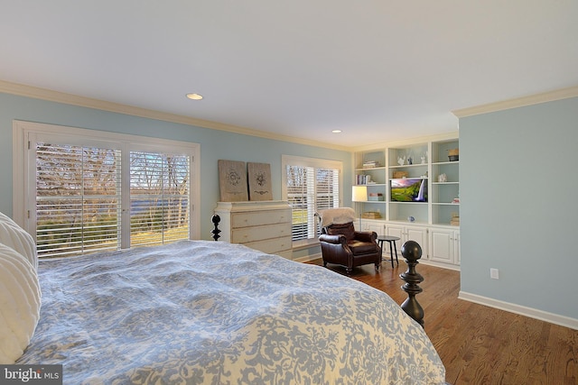 bedroom with ornamental molding and dark hardwood / wood-style floors