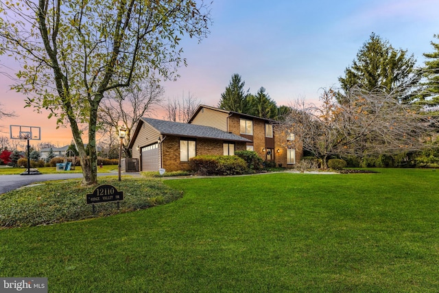 view of front of home featuring a garage, central AC unit, and a lawn