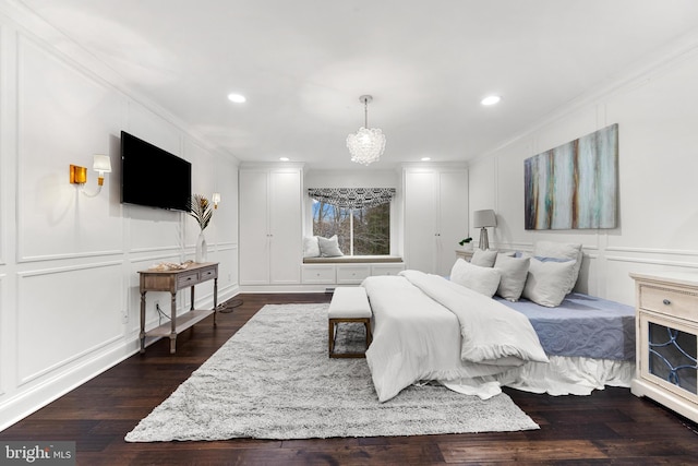 bedroom featuring crown molding and dark hardwood / wood-style flooring