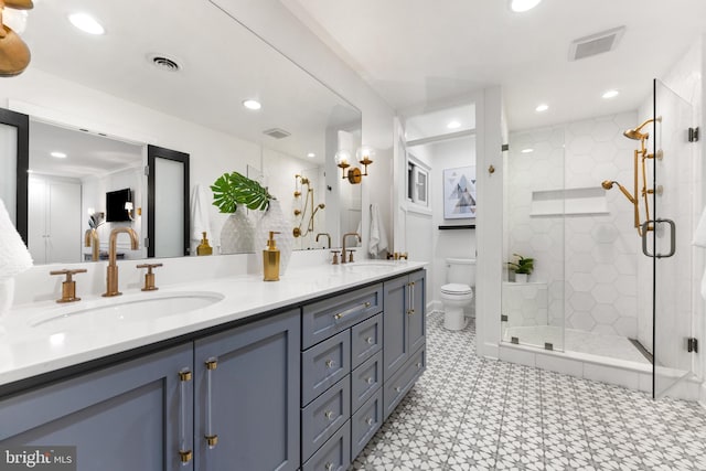 bathroom featuring vanity, toilet, and walk in shower