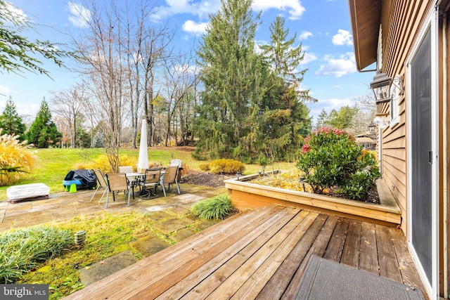 wooden deck featuring a patio area