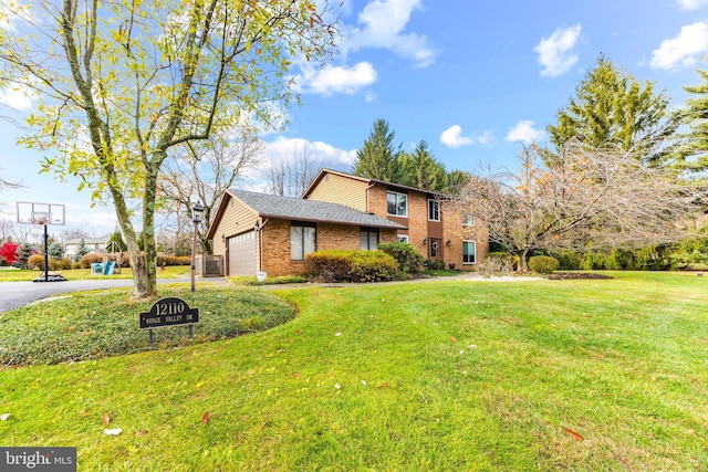 view of front of property featuring a garage, central AC unit, and a front lawn