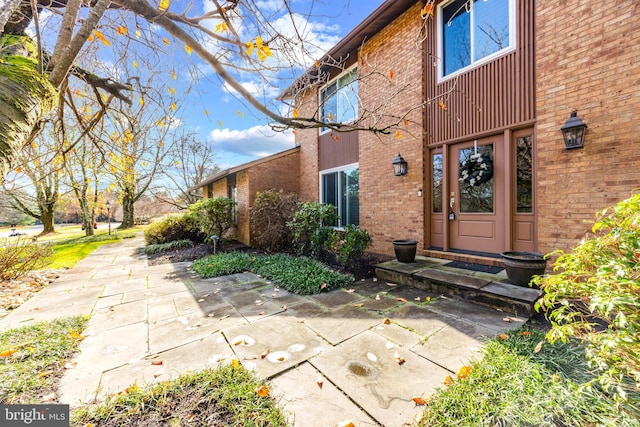 doorway to property featuring a patio