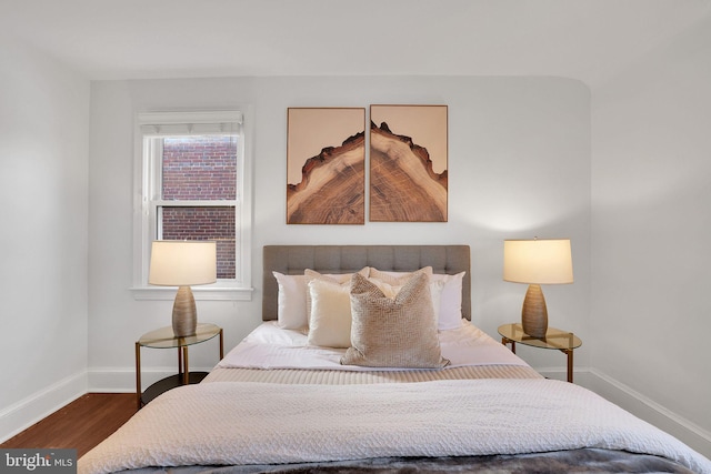 bedroom featuring dark hardwood / wood-style flooring