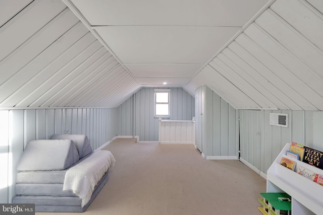 additional living space featuring lofted ceiling and light colored carpet