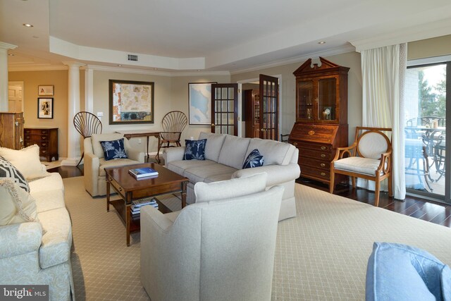 425 Windmere Dr Unit 2B, State College, PA 16801 - living room featuring a raised ceiling, crown molding, decorative columns, and hardwood / wood-style flooring