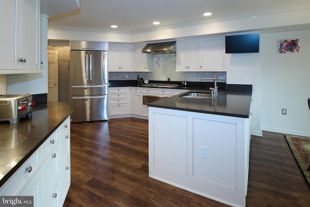 425 Windmere Dr Unit 2B, State College, PA 16801 - kitchen featuring white cabinetry, wall chimney exhaust hood, sink, appliances with stainless steel finishes, and decorative backsplash