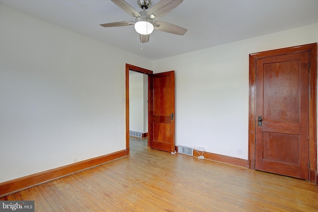 spare room with light hardwood / wood-style floors and ceiling fan