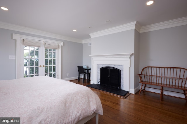 bedroom featuring french doors, dark hardwood / wood-style floors, and ornamental molding