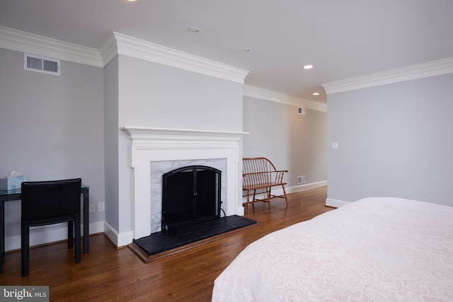 bedroom featuring dark hardwood / wood-style flooring and ornamental molding