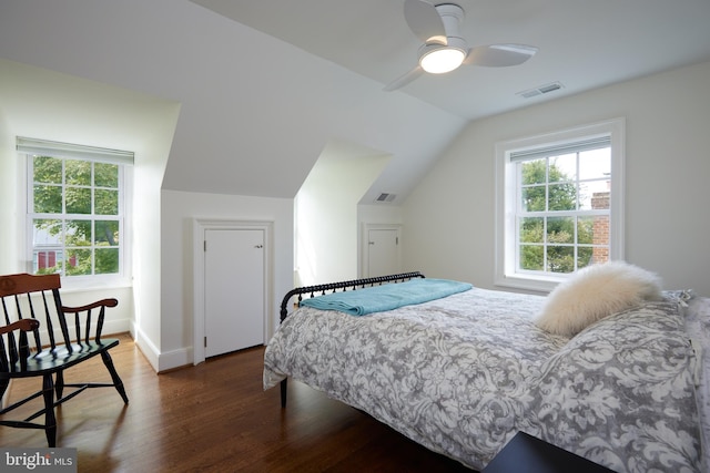 bedroom with lofted ceiling, dark hardwood / wood-style floors, and ceiling fan