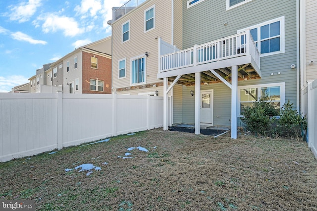 rear view of house featuring a deck