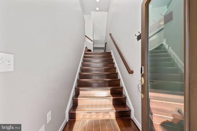 staircase featuring hardwood / wood-style floors