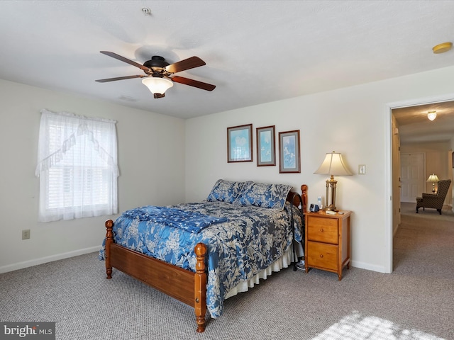 bedroom featuring ceiling fan and carpet floors