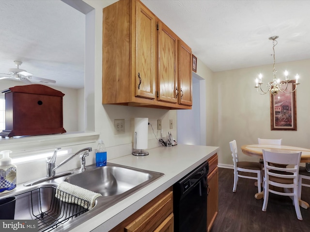 kitchen with sink, ceiling fan with notable chandelier, black dishwasher, dark hardwood / wood-style flooring, and decorative light fixtures