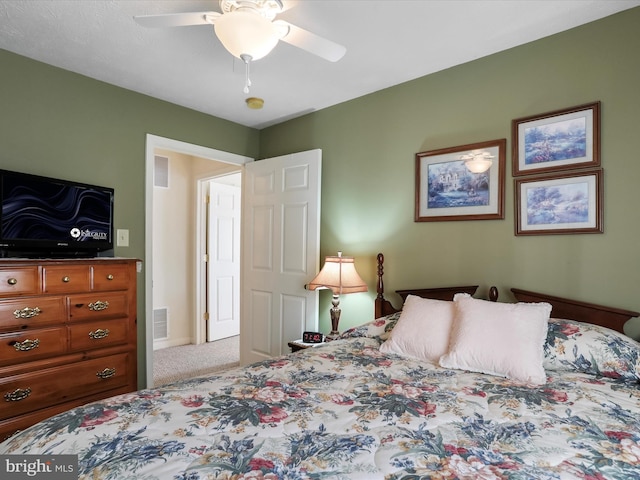 bedroom with ceiling fan and carpet