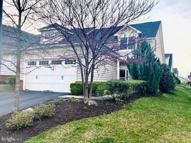 view of side of home featuring a lawn