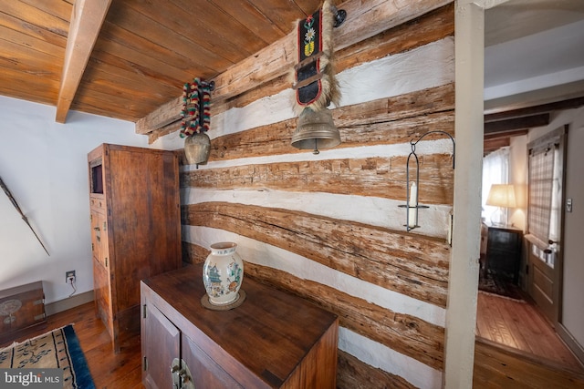 interior space featuring wood ceiling, hardwood / wood-style floors, and beamed ceiling