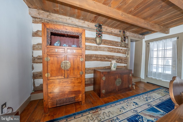 interior details with beamed ceiling, hardwood / wood-style floors, and wooden ceiling