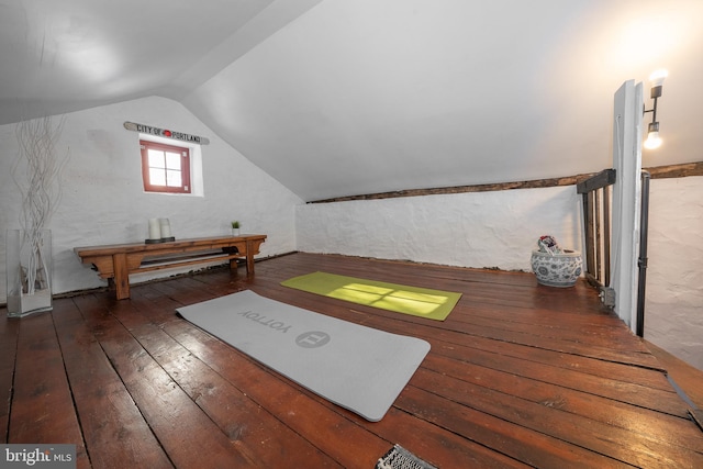 bonus room with lofted ceiling and dark wood-type flooring