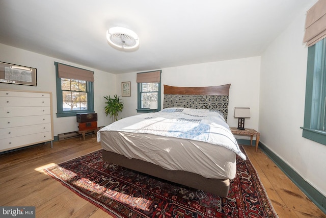 bedroom with wood-type flooring