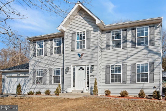 colonial inspired home featuring a garage