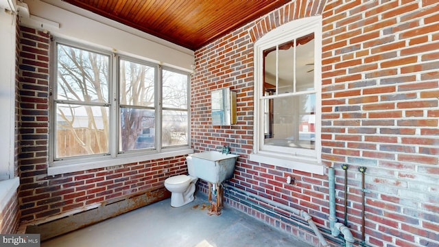 sunroom / solarium featuring wood ceiling