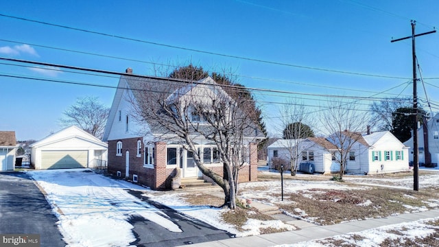 view of front of home featuring an outbuilding and a garage