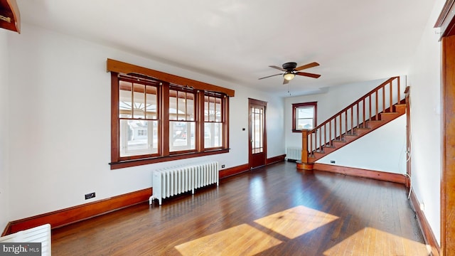 foyer featuring radiator heating unit, dark hardwood / wood-style floors, and ceiling fan