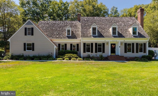9508 Ferry Harbour Ct, Alexandria, VA 22309 - cape cod home with a chimney and a front lawn