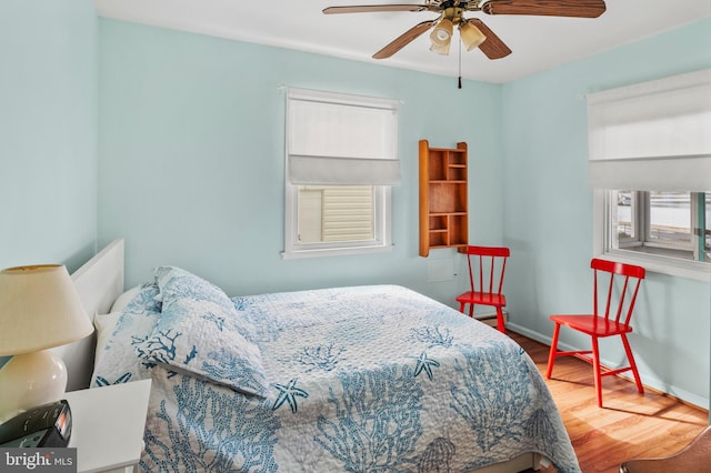 bedroom with hardwood / wood-style flooring and ceiling fan