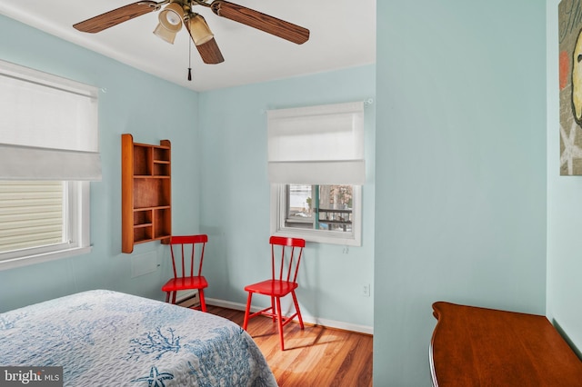 bedroom featuring hardwood / wood-style flooring and ceiling fan