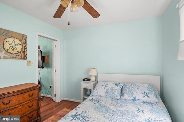 bedroom featuring hardwood / wood-style floors and ceiling fan