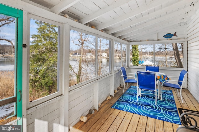 sunroom / solarium with lofted ceiling with beams and wooden ceiling