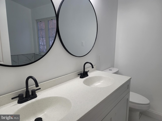 bathroom with vanity and toilet