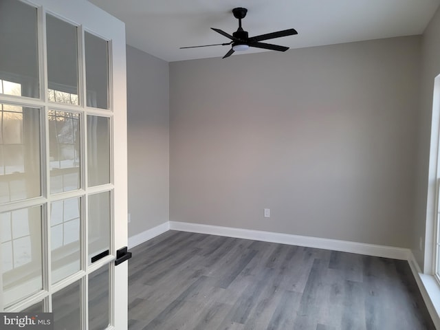 empty room with wood-type flooring and ceiling fan