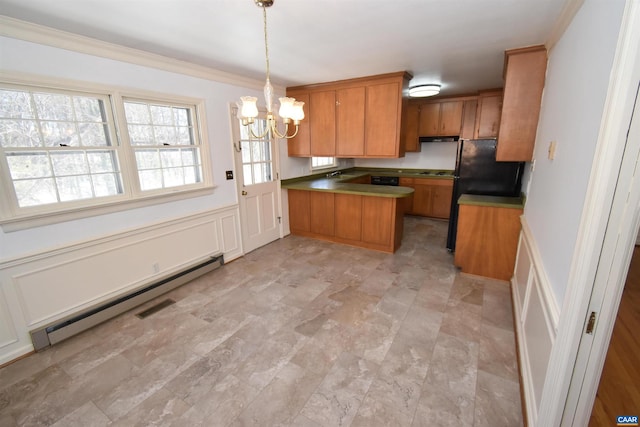 kitchen featuring crown molding, kitchen peninsula, pendant lighting, a baseboard heating unit, and a notable chandelier