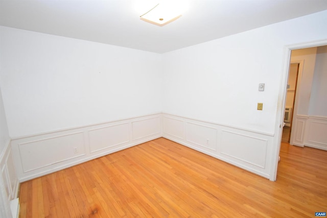 unfurnished room featuring light hardwood / wood-style floors