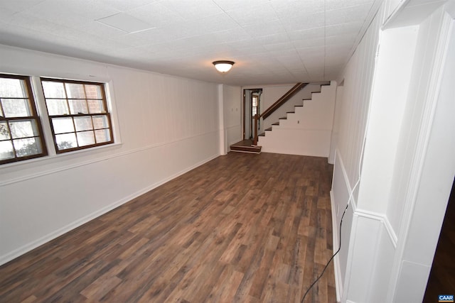 basement featuring dark hardwood / wood-style flooring