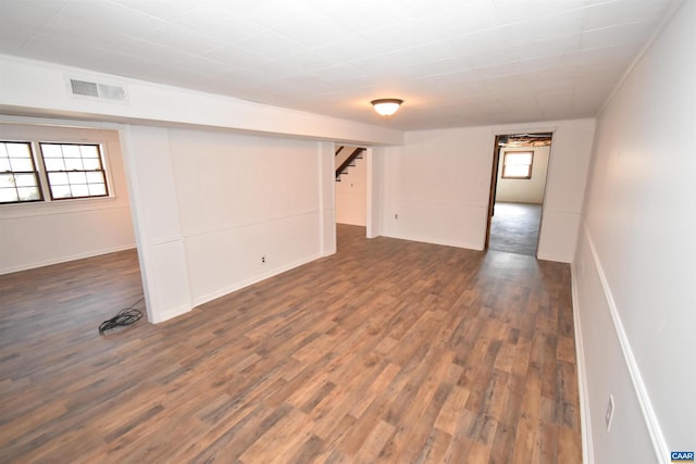 basement featuring dark hardwood / wood-style floors