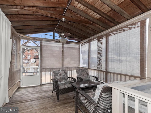 sunroom with ceiling fan, wooden ceiling, and vaulted ceiling with beams