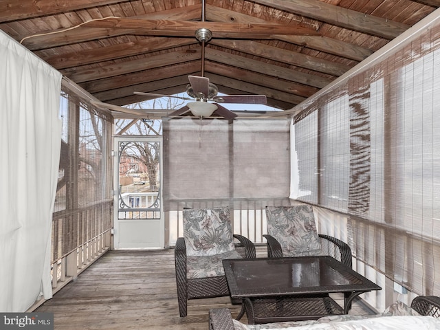 sunroom / solarium featuring ceiling fan, lofted ceiling with beams, and wooden ceiling