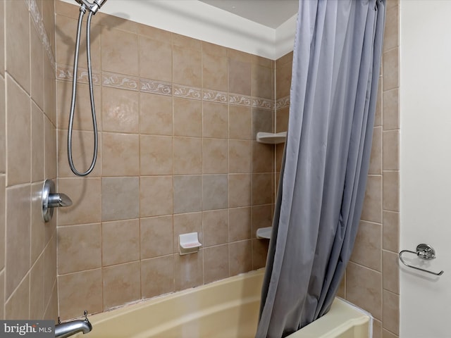 bathroom with shower / tub combo with curtain