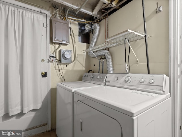 laundry area featuring washing machine and dryer and electric panel