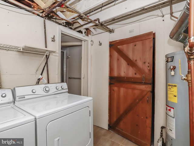 laundry room featuring washing machine and dryer and water heater