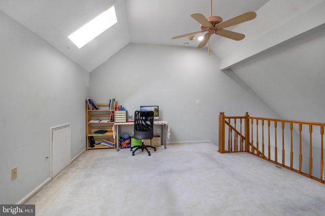 carpeted office space with lofted ceiling and ceiling fan