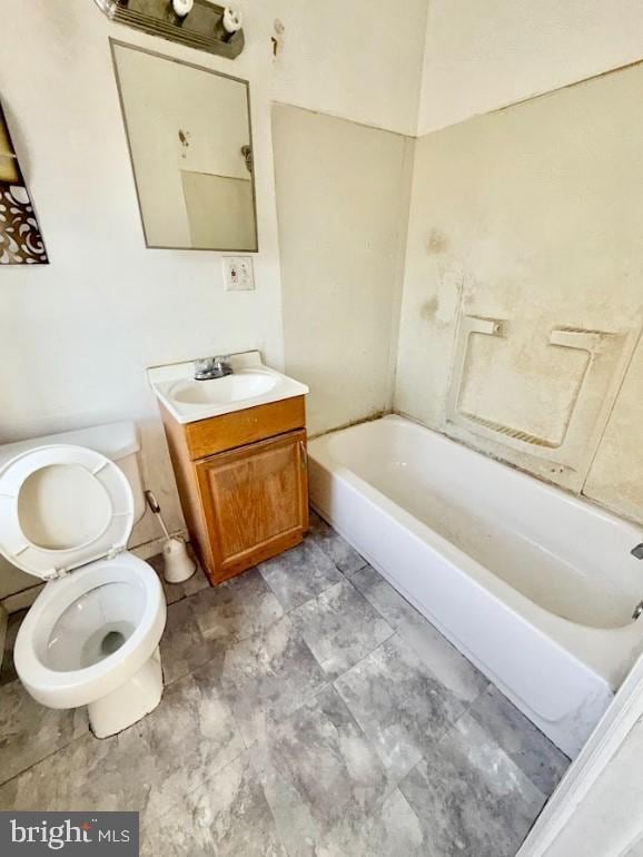 bathroom with toilet and vanity