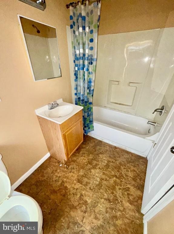 full bathroom with toilet, vanity, and shower / tub combo with curtain