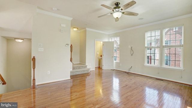 unfurnished living room featuring ornamental molding, ceiling fan, and light hardwood / wood-style flooring