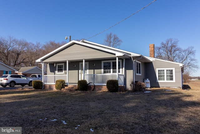 ranch-style home featuring a porch